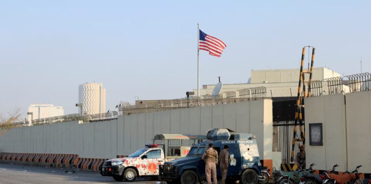 Security personnel stand outside the US Consulate in Karachi after visa services were suspended due to violent protests in Pakistan.